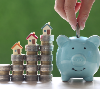 model-house-stack-coins-money-natural-green-background